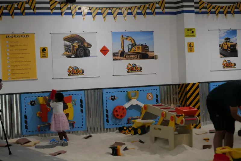 Child playing with the interactive wall panels
