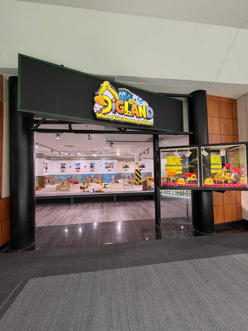 The DigLand Kids storefront with its illuminated sign